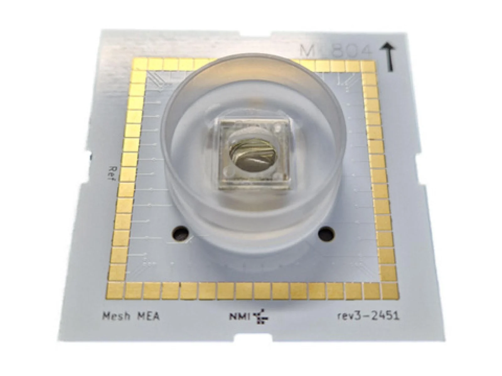 A square circuit-board plate with a ring of gold electrode pads around a clear round well