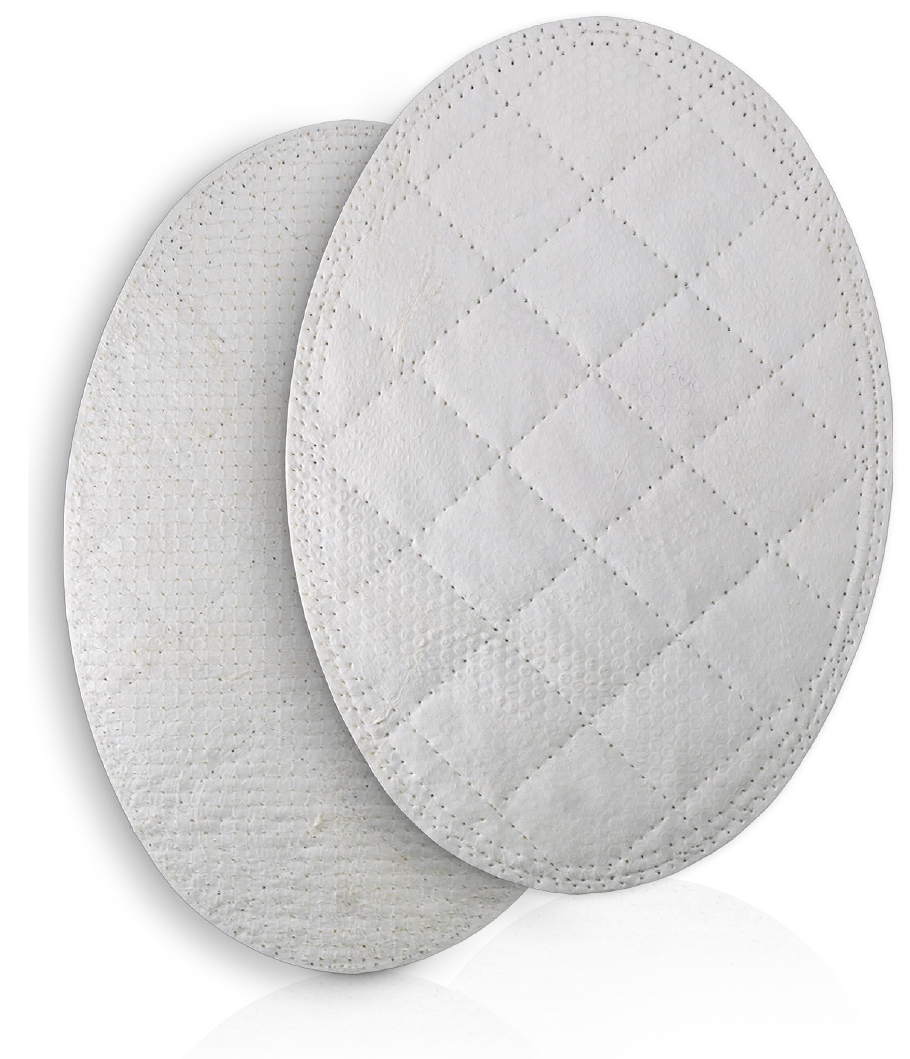 Two oval pads of reinforced tissue matrix, one quilted with a diamond pattern of dotted stitches